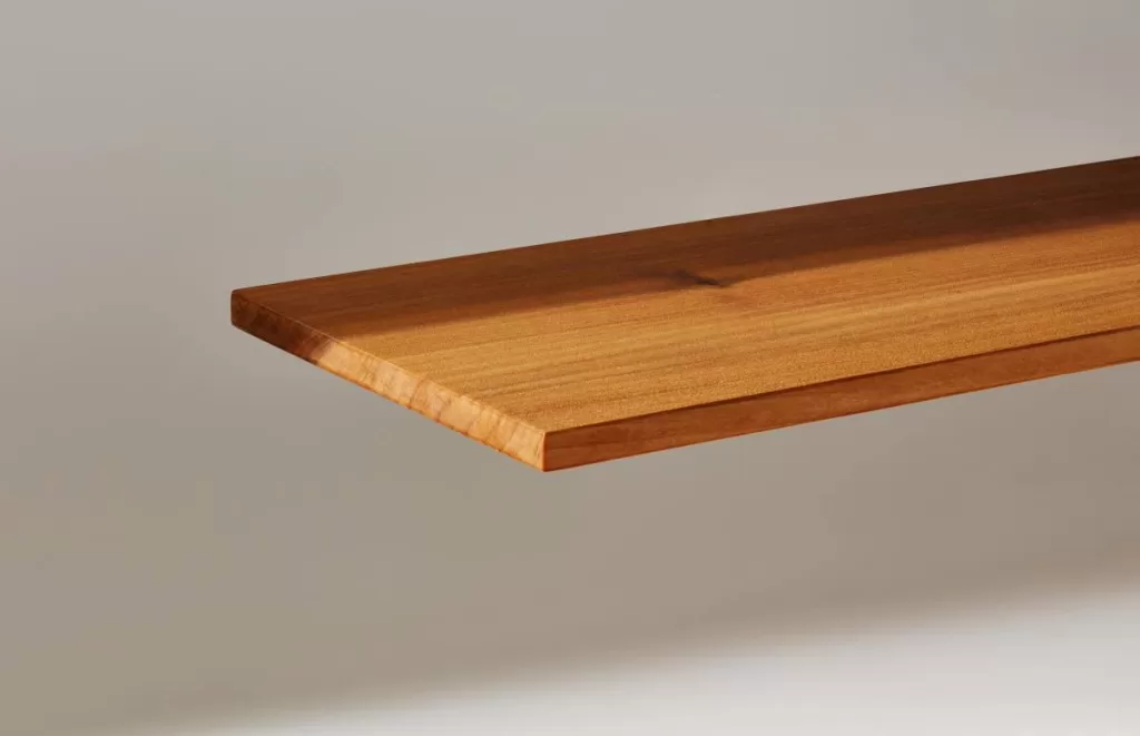 A plank of InventWood Superwood stands against a white background.