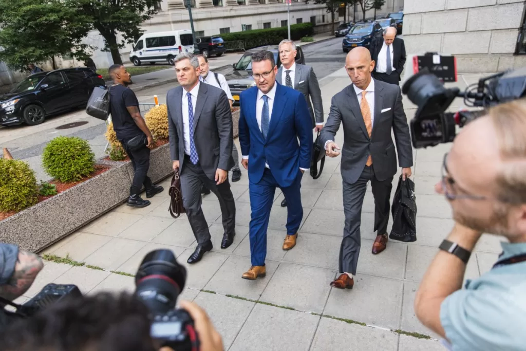 Trevor Milton, founder of Nikola Corp., center, exits court in New York, US