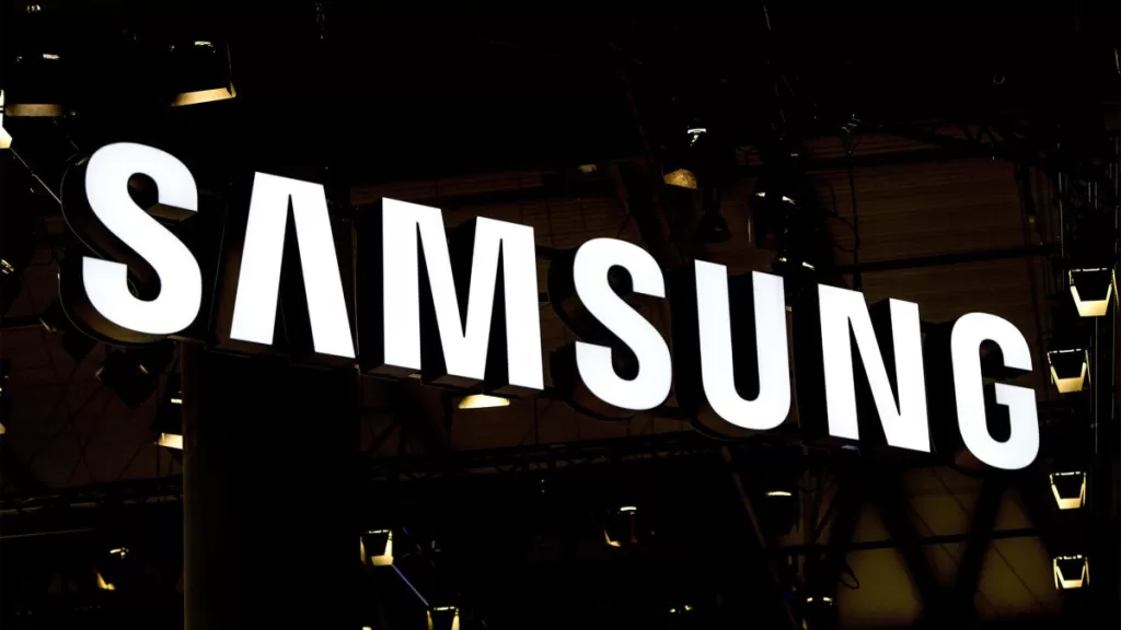 A logo sits illuminated outside the Samsung pavilion on the opening day of the World Mobile Congress
