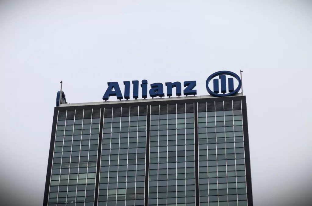 a photo of Allianz's logo at the top of a building.