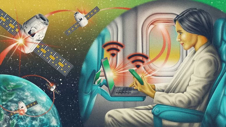 الصورة قد تحتوي على: ملابس، قفاز، بالغ، شخص، حاسوب، إلكترونيات، لابتوب، كمبيوتر، إعلان، كرسي، وأثاث