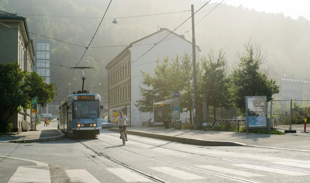 Image may contain City Road Street Urban Person Neighborhood Car Transportation Vehicle Bicycle and Nature