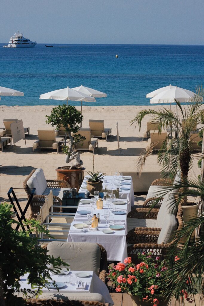 Image may contain Dining Table Furniture Table Boat Transportation Vehicle Person Chair Plant Nature and Outdoors